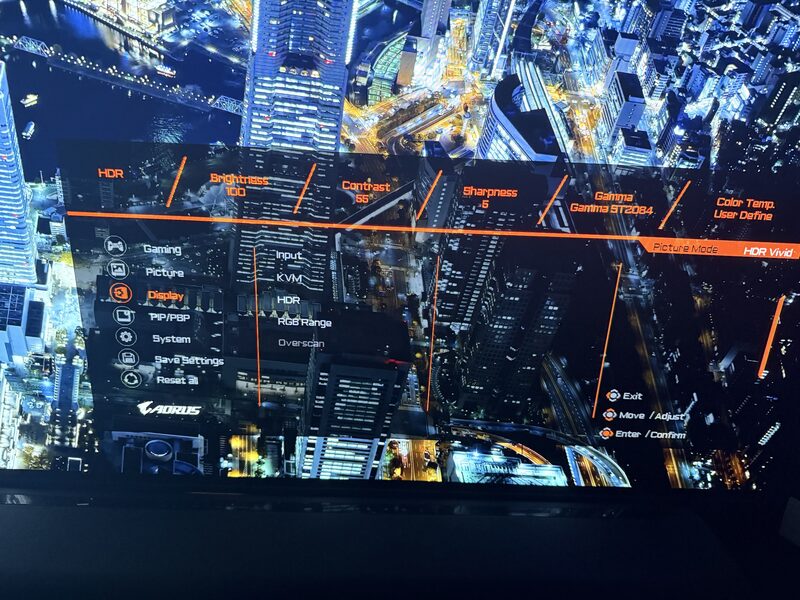 AORUS FO48U OSD Display menu showing Input selector, KVM submenu, HDR submenu, RGB Range, Overscan