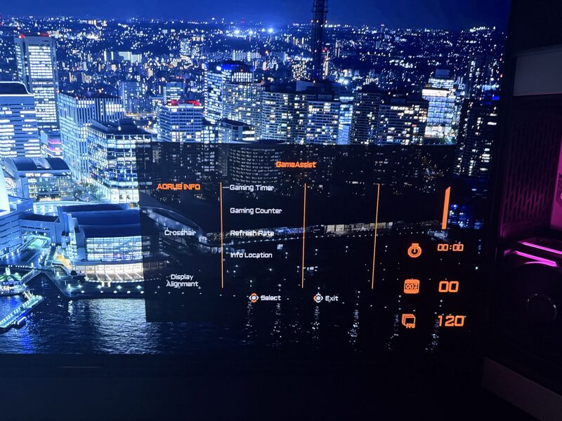 AORUS FO48U OSD Game Assist menu close-up showing FPS readout 120, Gaming Timer, Gaming Counter, Refresh Rate, Info Location and on-screen 120Hz indicator