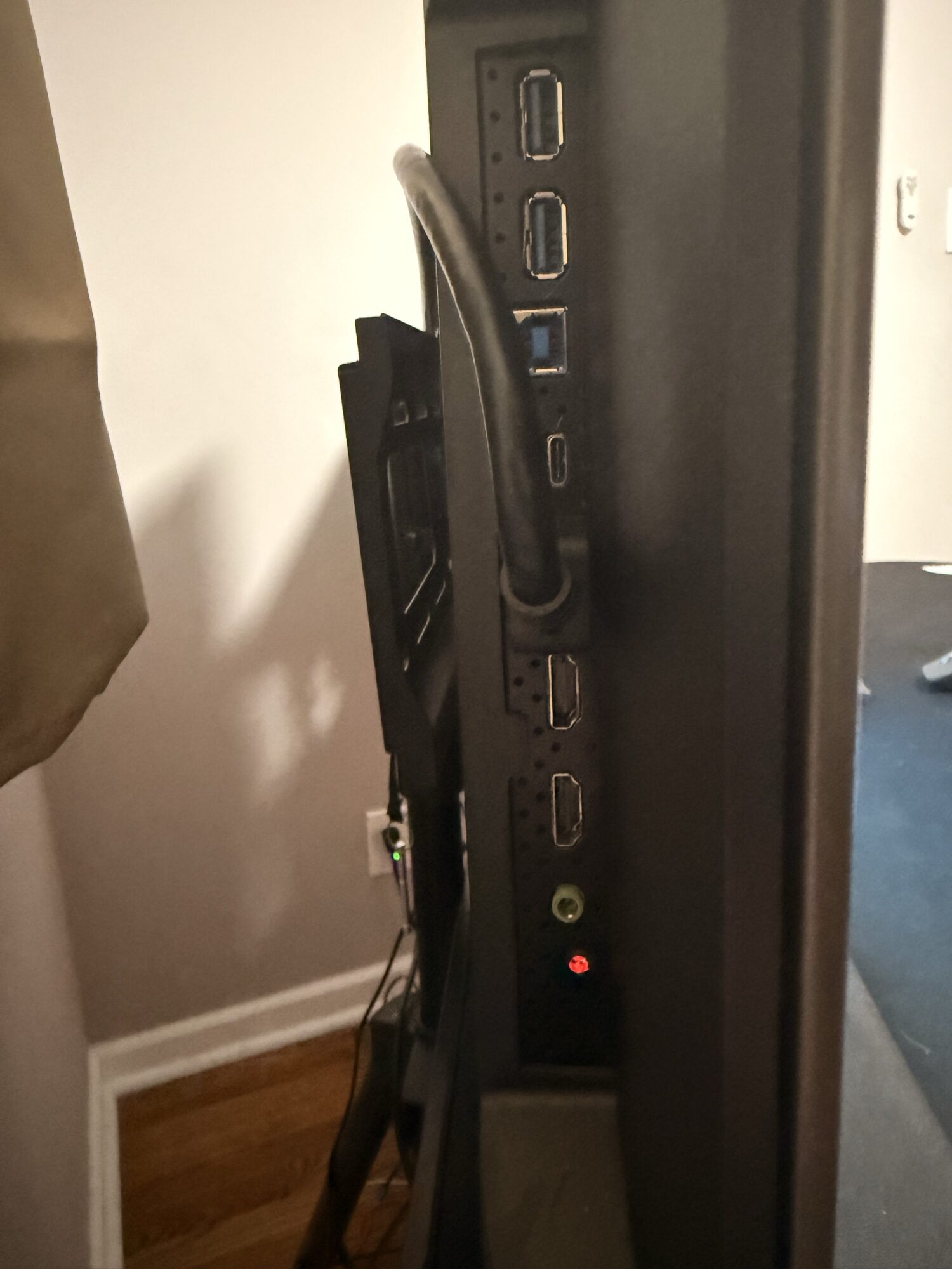 AORUS FO48U port cluster showing two USB-A downstream, USB-B upstream, USB-C, two HDMI 2.1, 3.5mm headphone output, and DisplayPort 1.4