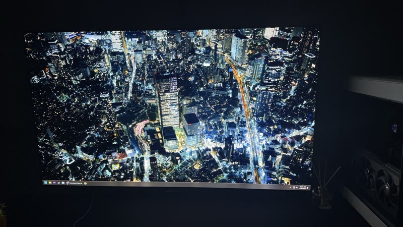 AORUS FO48U showing Tokyo night aerial cityscape angle 2, slightly different camera position