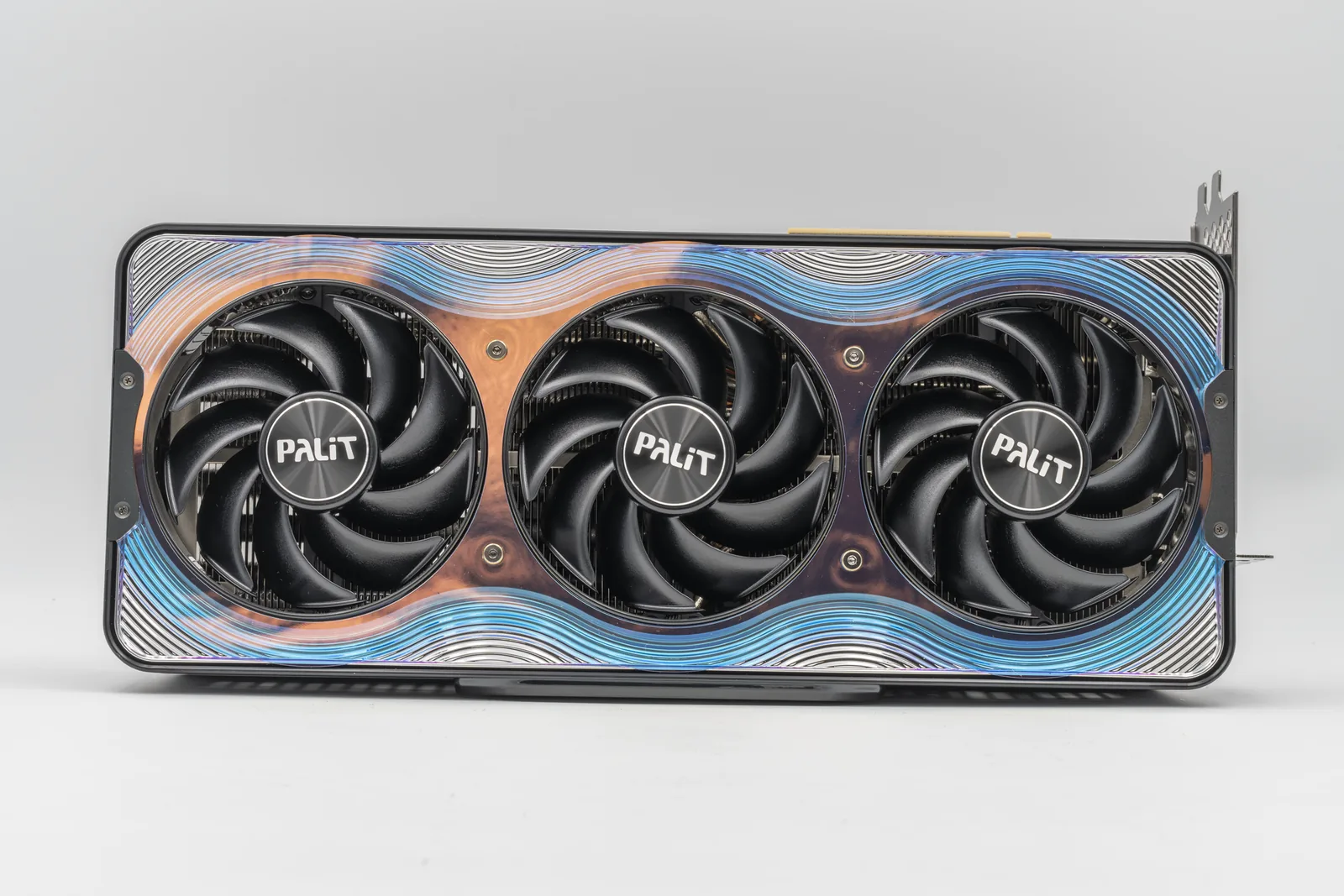 A Palit GeForce RTX 5090 GameRock graphics card photographed head-on against a white background, its three fans and patterned shroud visible